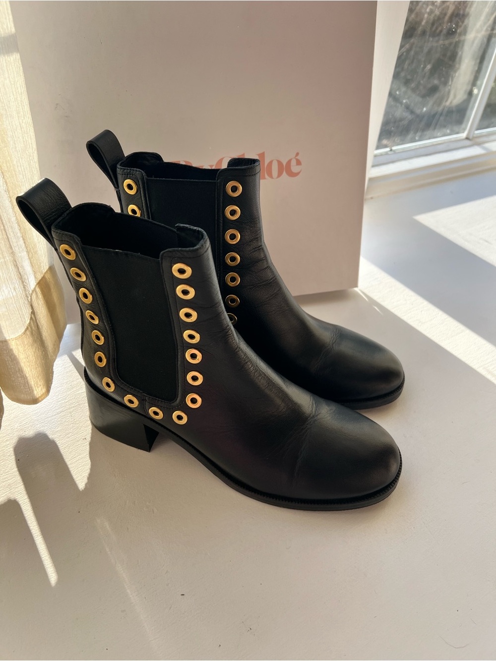 See By Chloé Black Leather Chelsea Boots with Gold Eyelets